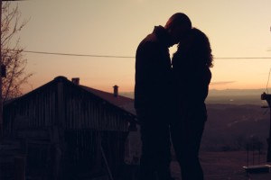 kissing couple at dawn