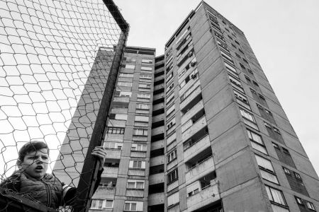 The boy behind the fence