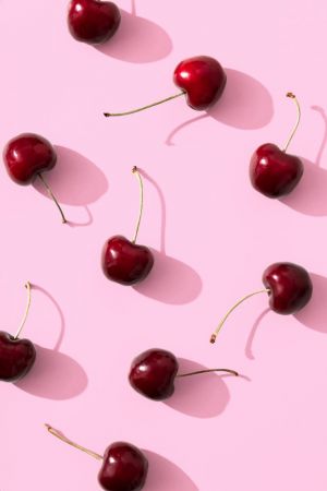 Cherries on pink background