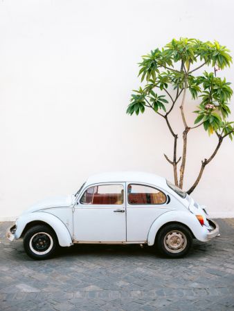Pastel Volskwagen Beetle in the streets of Oaxaca Mexico